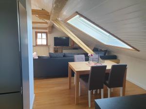 a kitchen and dining room with a table and chairs at Ferienwohnung Flösserstube in Bichel