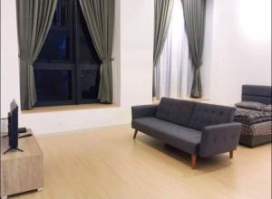 A seating area at Sunway Grid by One Team