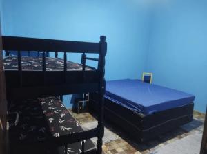 a pair of bunk beds with a blue sky in the background at Chácara a 450mt da Praia Boracéia piscina infantil e outra adulto in São Sebastião +24 photos
