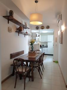 a kitchen and dining room with a table and chairs at Casetta Donatello in Marina di Pietrasanta
