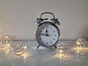 an alarm clock sitting on a table with lights at Villa Międzyzdroje in Międzyzdroje +31 photos