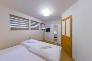Posteľ alebo postele v izbe v ubytovaní Apartmány Lipno 46