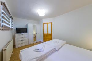 Posteľ alebo postele v izbe v ubytovaní Apartmány Lipno 46
