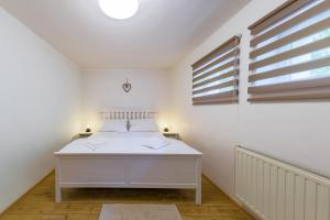 Posteľ alebo postele v izbe v ubytovaní Apartmány Lipno 46