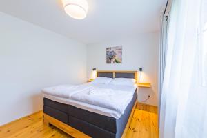 Posteľ alebo postele v izbe v ubytovaní Apartmány Lipno 46