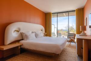 Cama ou camas em um quarto em Les Terrasses du Bailli
