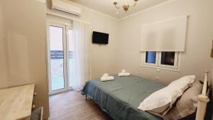 Postel nebo postele na pokoji v ubytování PIERI HOUSE CORFU