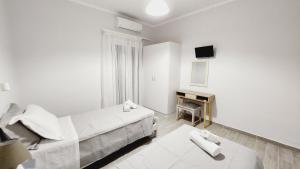 Postel nebo postele na pokoji v ubytování PIERI HOUSE CORFU