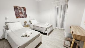 Postel nebo postele na pokoji v ubytování PIERI HOUSE CORFU