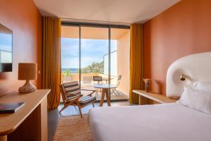 Cama ou camas em um quarto em Les Terrasses du Bailli