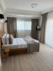 Postel nebo postele na pokoji v ubytování Nova Butik Hotel Çeşme