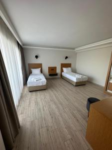 Postel nebo postele na pokoji v ubytování Nova Butik Hotel Çeşme