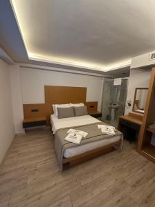 Postel nebo postele na pokoji v ubytování Nova Butik Hotel Çeşme