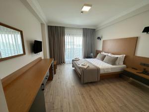 Postel nebo postele na pokoji v ubytování Nova Butik Hotel Çeşme