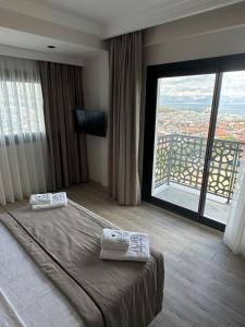 Postel nebo postele na pokoji v ubytování Nova Butik Hotel Çeşme