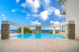 an image of a swimming pool in a house at Frontière Monaco, Terrasse Vue Mer, Tour Odeon - AP in Beausoleil