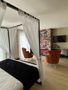 Postel nebo postele na pokoji v ubytování Alp de Veenen Hotel