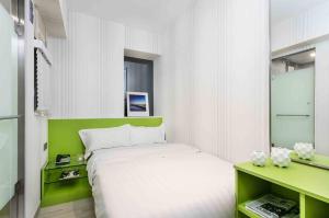 Voodi või voodid majutusasutuse 珀依旅馆 Pop E INN toas
