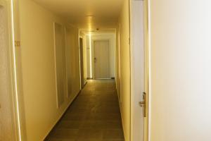 an empty hallway with a hallway leading into a room at Shellghada Blue Beach in Hurghada