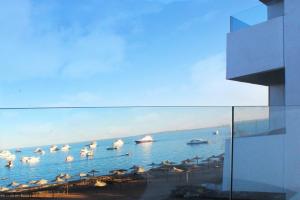 a view of a beach with boats in the water at Shellghada Blue Beach in Hurghada