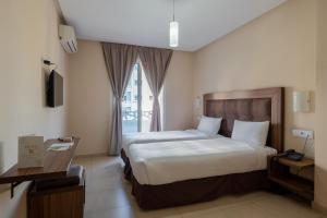 Uma cama ou camas num quarto em Hotel Etoile Du Nord