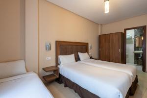 Uma cama ou camas num quarto em Hotel Etoile Du Nord
