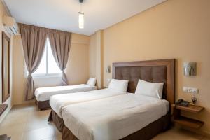 Uma cama ou camas num quarto em Hotel Etoile Du Nord