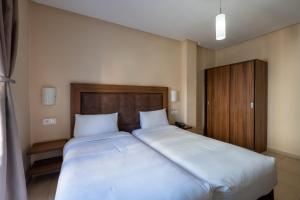 Uma cama ou camas num quarto em Hotel Etoile Du Nord