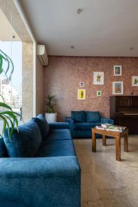 Uma área de estar em Hotel Etoile Du Nord