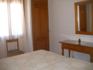 A bed or beds in a room at Apartamentos Can Jordi