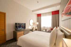 TV a/nebo společenská místnost v ubytování Peony Hotel