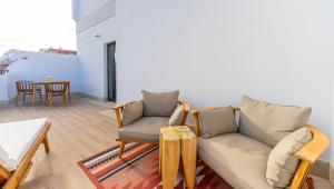 a living room with a couch and chairs and a table at DWO Nopal in Puerto de la Cruz