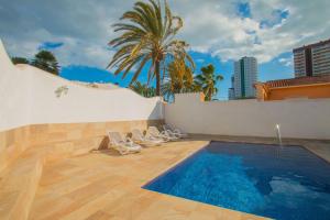 a swimming pool on the roof of a building at Villa Corina - Plusholidays in Calpe