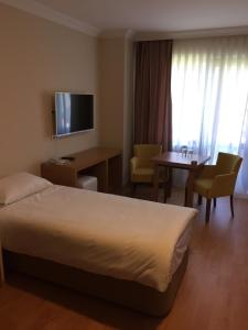 Krevet ili kreveti u jedinici u objektu Emsa Palace Hotel