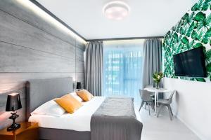 Posteľ alebo postele v izbe v ubytovaní Apartamenty Sun & Snow Dune B