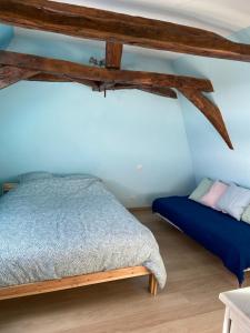 Posteľ alebo postele v izbe v ubytovaní Notre petite maison dans la prairie