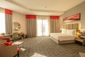 Postel nebo postele na pokoji v ubytování Peony Hotel