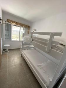 a room with two bunk beds and a window at XALAKAS SUMMER HOUSE in Empourios