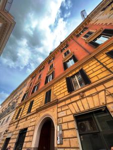 an old brick building with an archway in front of it at Dolce Vita Guest House in Rome