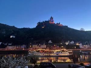 a city with a castle on top of a hill at Haus Ostermann in Cochem