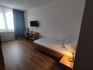 Postel nebo postele na pokoji v ubytování Hotel Sonnenkeller