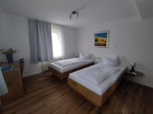 Postel nebo postele na pokoji v ubytování Hotel Sonnenkeller