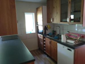 a kitchen with a sink and a counter top at Sittesta 56 in Ösmo +9 photos