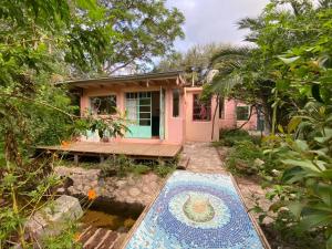 a house with a mosaic floor in front of it at La casa de Tania in San Marcos Sierras