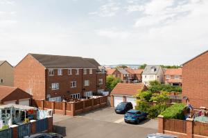 a view of a residential neighbourhood with brick buildings at Thinford View in Spennymoor