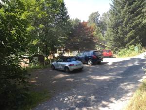 two cars parked on the side of a road at Sittesta 56 in Ösmo