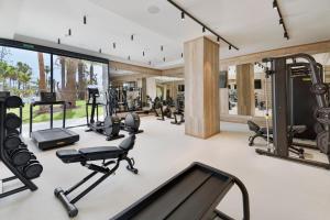 an open gym with treadmills and cardio equipment at Paradisus Gran Canaria in San Agustin