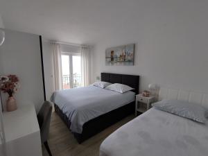 Posteľ alebo postele v izbe v ubytovaní Apartments Proto