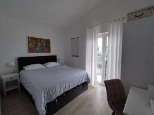 Posteľ alebo postele v izbe v ubytovaní Apartments Proto