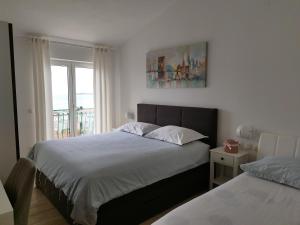 Posteľ alebo postele v izbe v ubytovaní Apartments Proto